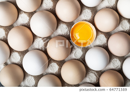 Chicken eggs in organic packaging closeup Chicken eggs in organic packaging closeup 64771389