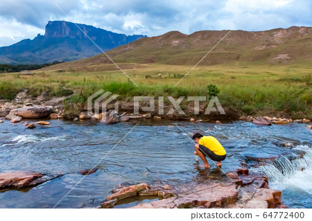 Man relaxing in nature. View of Dead Sea. Man relaxing in nature. View of Dead Sea. 64772400
