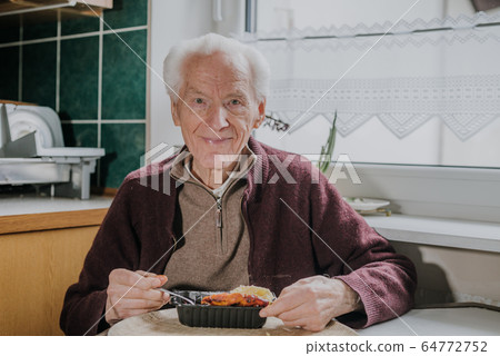 Portrait senior eats dinner at home Portrait senior eats dinner at home 64772752