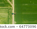 Agriculture Tractor Working in Field 64773096