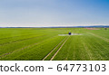 Tractor Spraying Herbicides on Field Agriculture 64773103