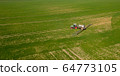 Agriculture Tractor Working in Field 64773105