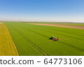 Agriculture Tractor Working in Field 64773106