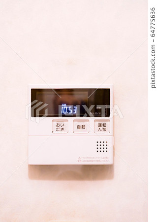 Remote control of home water heater installed on the white wall 64775636