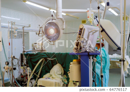 Surgeons team of doctors in the operating room Surgeons team of doctors in the operating room 64776517