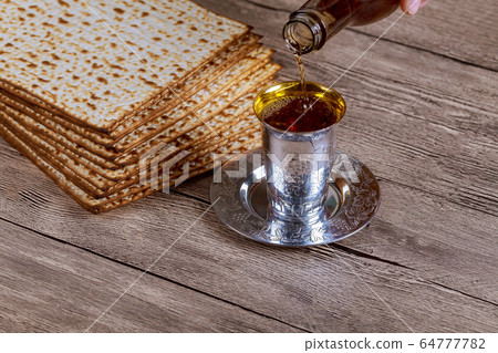 Jewish Pesah celebrating, matzoh and traditional 64777782