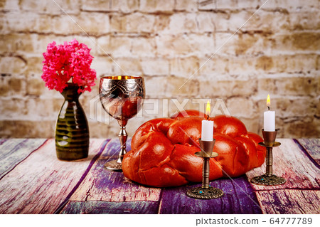 Shabbat candles in candlesticks of loaves challah Shabbat candles in candlesticks of loaves challah 64777789