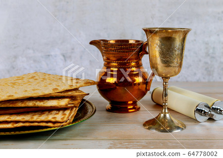Jewish Pesah celebrating, matzoh and traditional Jewish Pesah celebrating, matzoh and traditional 64778002