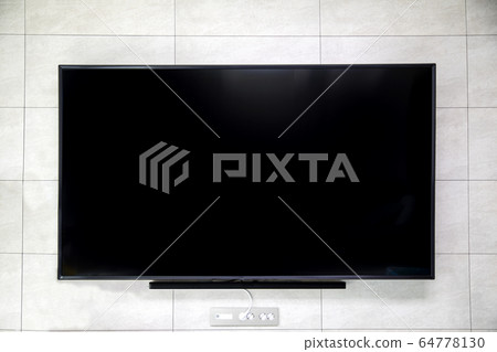 A large television mounted on the wall 64778130