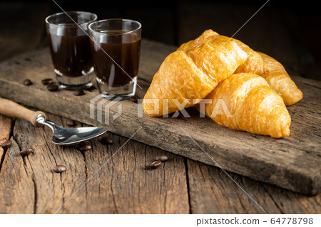 Coffee and croissants on the wooden background, 64778798