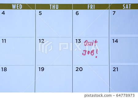 Quit job words written on table calendar with red 64778973