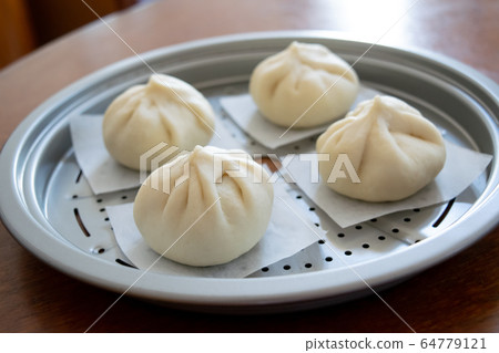 Handmade meat buns at home, before being steamed Handmade meat buns at home, before being steamed 64779121