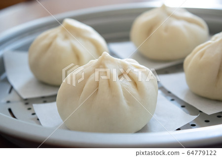 Handmade meat buns at home, before being steamed Handmade meat buns at home, before being steamed 64779122