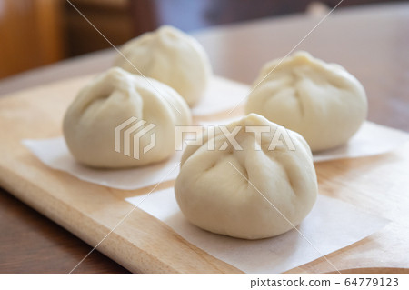 Handmade meat buns at home, before being steamed Handmade meat buns at home, before being steamed 64779123