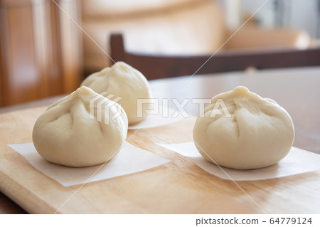 Handmade meat buns at home, before being steamed Handmade meat buns at home, before being steamed 64779124