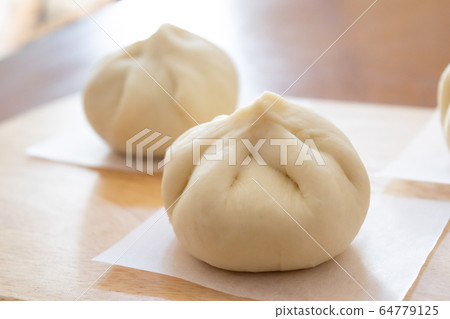Handmade meat buns at home, before being steamed Handmade meat buns at home, before being steamed 64779125