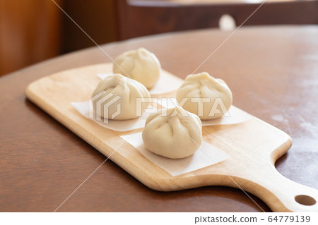 Handmade meat buns at home, before being steamed 64779139