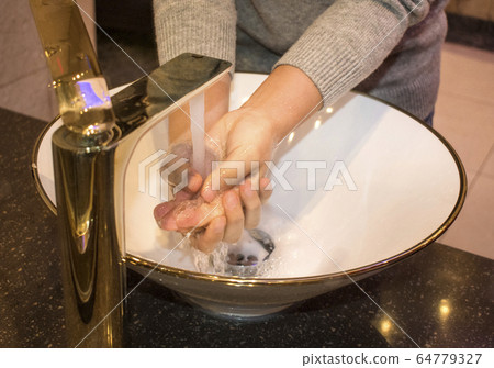 Hand washing Hand washing 64779327