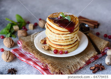 Delicious fresh beautiful pancakes with citrus Delicious fresh beautiful pancakes with citrus 64779455