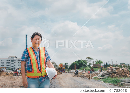 Woman construction engineer at construction site 64782058