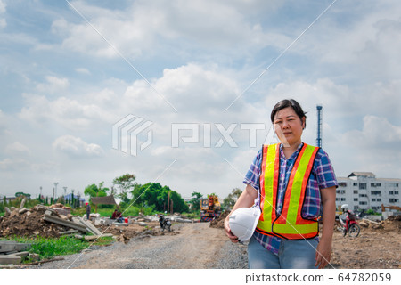 Woman construction engineer at construction site 64782059