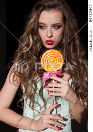 Woman With Long Hair Eats Candy Sweet Lollipop Stock Photo 64783406 Pixta