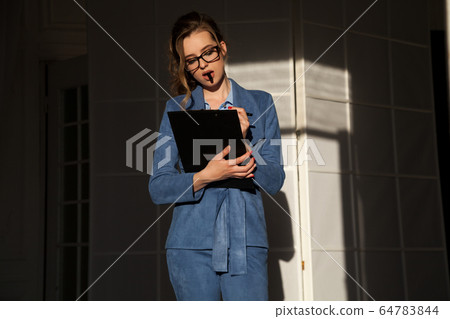 beautiful business woman in business suit office worker beautiful business woman in business suit office worker 64783844