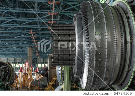 Gas turbine or a jet engine is a power plant of aircraft to fly in the air.Disassembly engine during repair and maintenance. 64784109
