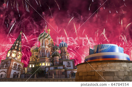 Temple of Basil the Blessed and fireworks in honor of Victory Day celebration (WWII), Moscow, Russia. 64784554