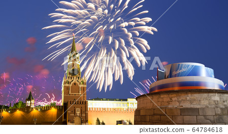 Moscow Kremlin and fireworks in honor of Victory Day celebration (WWII),  Red Square, Moscow, Russia. 64784618