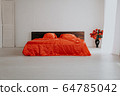 the Interior of the white room with a bed with red 64785042