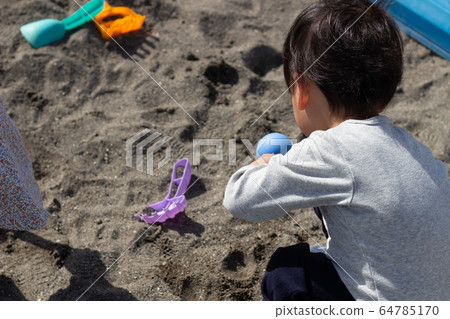 Children playing sandbox 64785170