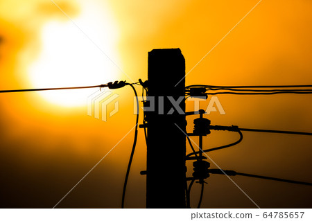 Sunset and Eletricity line and electricity post Sunset and Eletricity line and electricity post 64785657