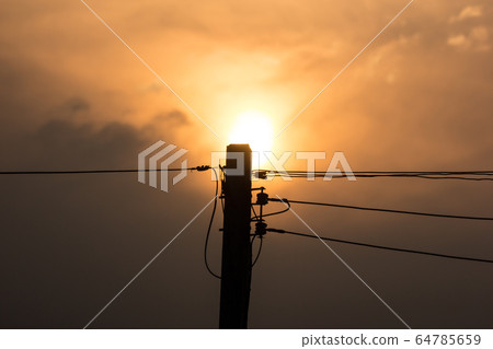 Sunset and Eletricity line and electricity post Sunset and Eletricity line and electricity post 64785659
