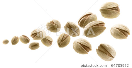 Salted pistachios levitate on a white background Salted pistachios levitate on a white background 64785952