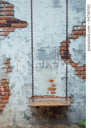 Swing chairs and the old plaster walls. 64786562
