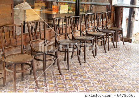 Old wooden chairs in the aisles Old wooden chairs in the aisles 64786565