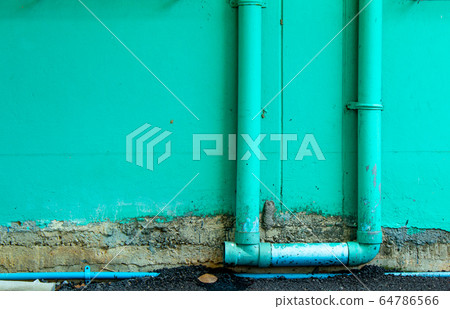 The brick wall is painted green and the water started to damage. The brick wall is painted green and the water started to damage. 64786566