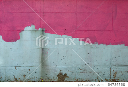 The brick wall is painted pink, not yet started off. 64786568