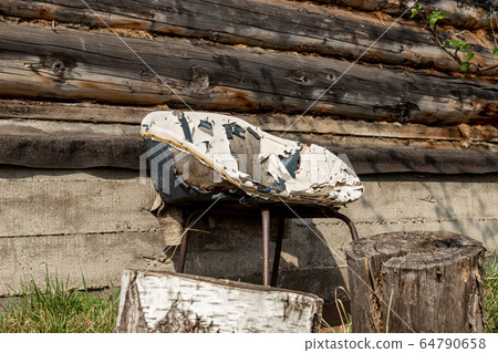 Very old chair on the backyard Very old chair on the backyard 64790658