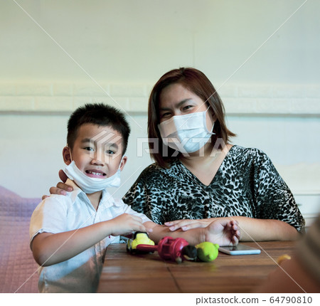 asian family quarantine at home while corona virus 64790810