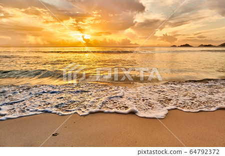 Beautiful sunset at Seychelles beach 64792372