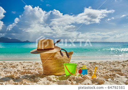 Beautiful beach with bag and toys at Seychelles 64792381