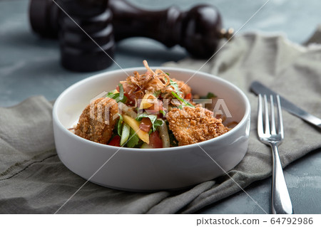 Salad with Fried chicken nuggets and vegetables Salad with Fried chicken nuggets and vegetables 64792986