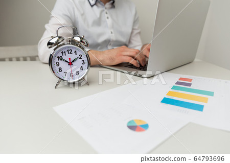 Accounting at home at quarantine. Man working on computer and calculator. Accounting at home at quarantine. Man working on computer and calculator. 64793696