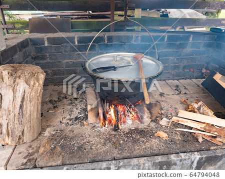 Hot bubbling boiling water with meat and bones Hot bubbling boiling water with meat and bones 64794048