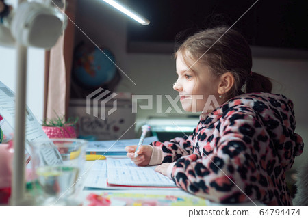 little girl at distance home schooling, study lessons on quarantine 64794474