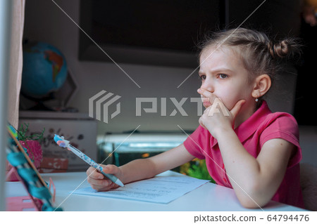 little girl at distance home schooling, study lessons on quarantine little girl at distance home schooling, study lessons on quarantine 64794476