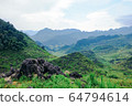 The beautiful landscape scenery of Dong Van rock plateau with mountains, rocks, and trees, located at the most northern point in Ha Giang the most popular destination in this region Vietnam. The beautiful landscape scenery of Dong Van rock plateau with mountains, rocks, and trees, located at the most northern point in Ha Giang the most popular destination in this region Vietnam. 64794614