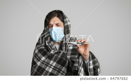 Man on quarantine. Self isolation with high temperature 64797882